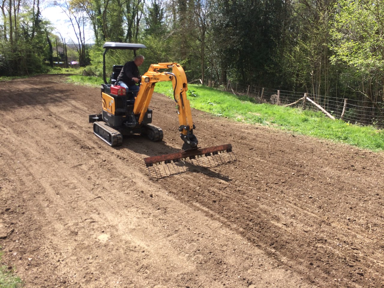  Raking in grass seed 